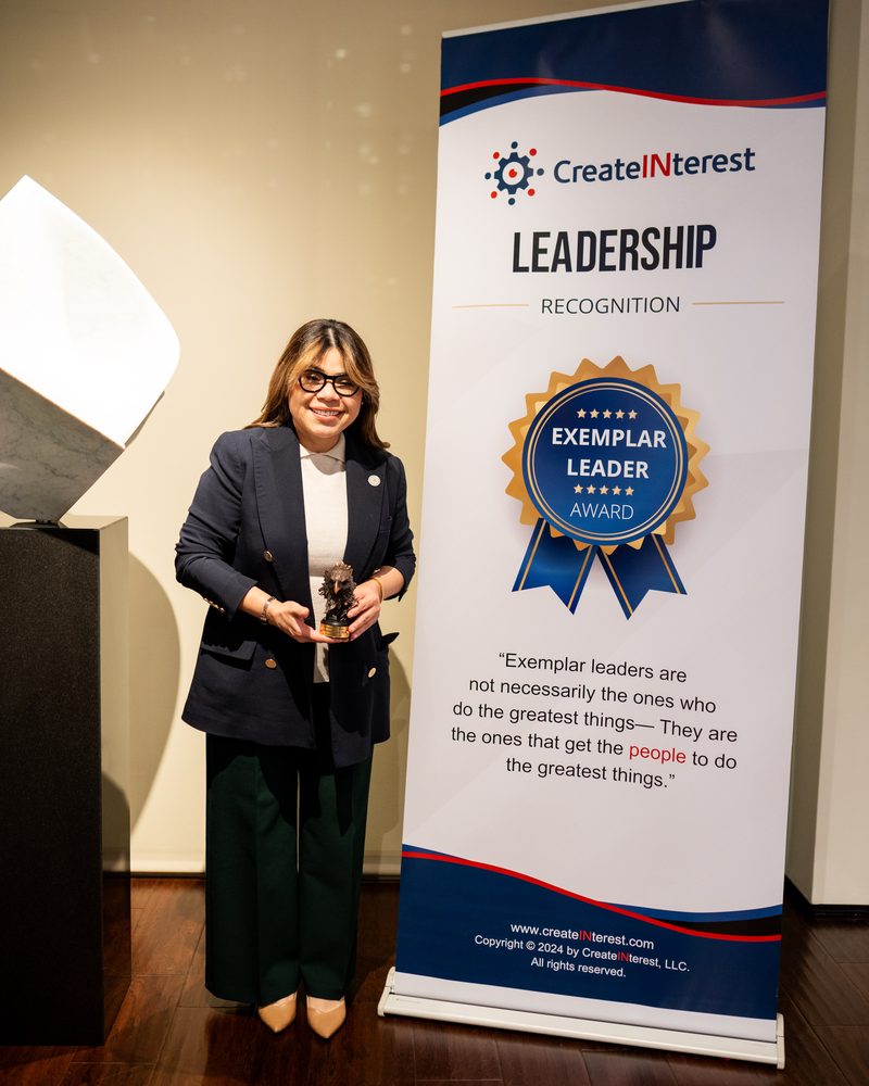 Create Interest Exemplar Leader Award recipient at leadership recognition ceremony